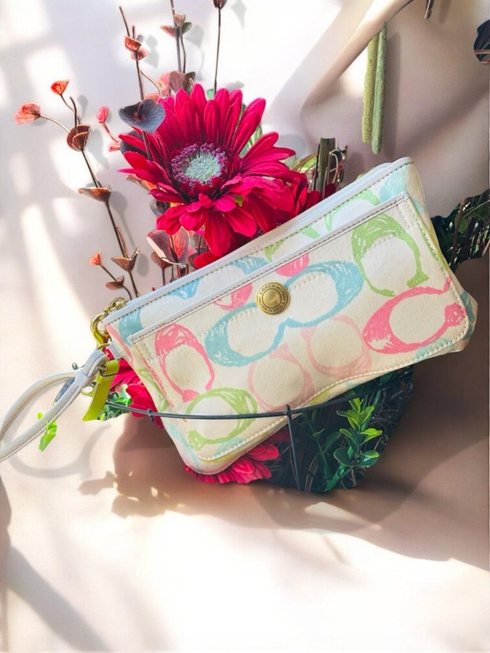 a vintage Coach Y2K pastel scribble wristlet ivory Canvas bag
